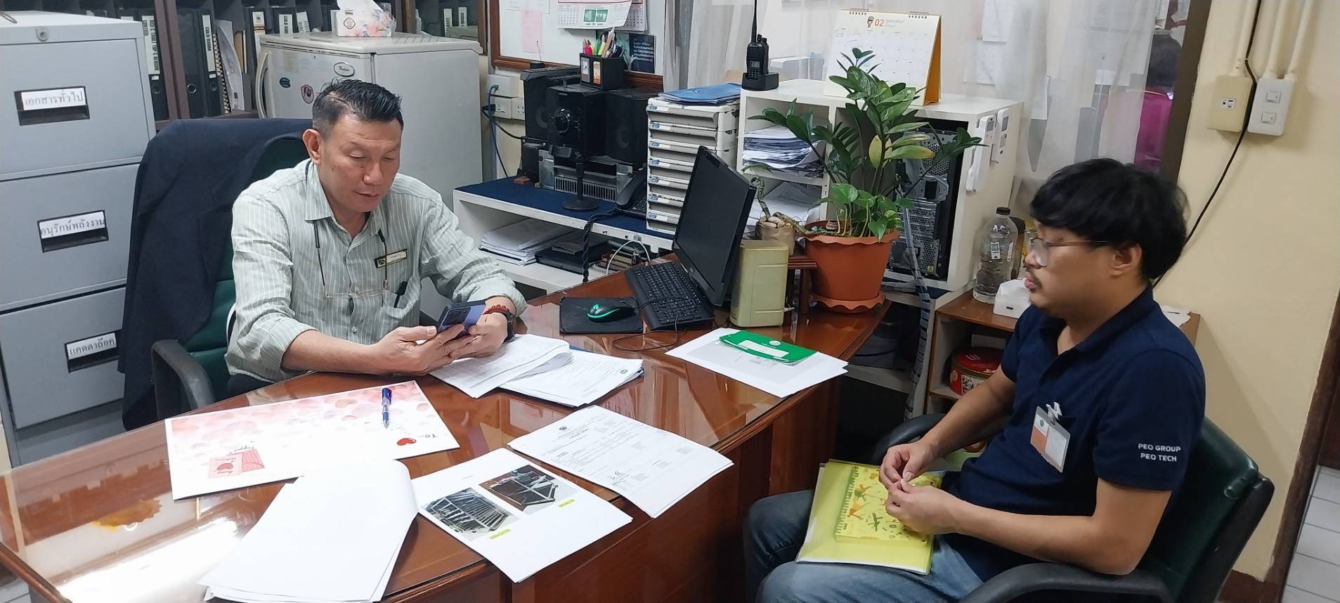 Michael Ananpasin in a one-on-one advisory working session over documents